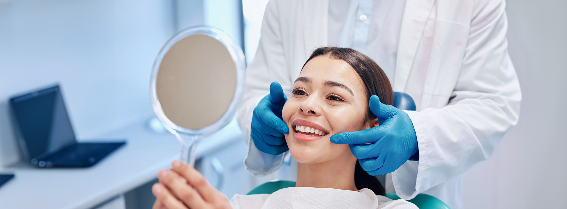 A cosmetic dermatologist is performing a facial treatment on a client in a professional setting.