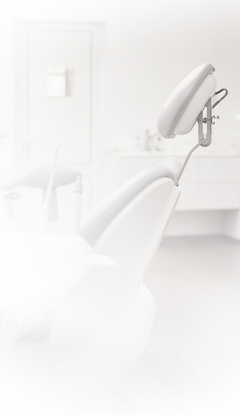 The image shows a modern dental or medical office interior with a dental chair, equipment, and a clean, professional environment.